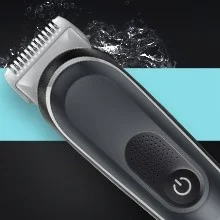 Image of the groomer in front of water