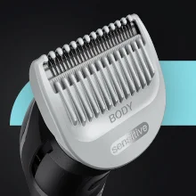 Image of the head of the groomer with the Sensitive Comb attached
