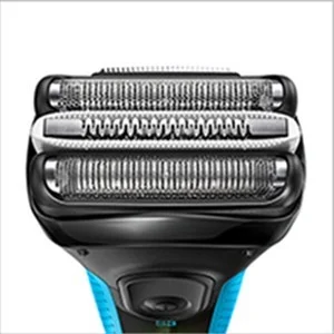 Braun electric shaver head, close-up view showing the three cutting elements.