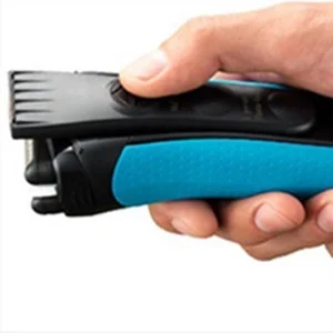 Braun trimmer being held, showing the adjustable length setting on the trimming head.