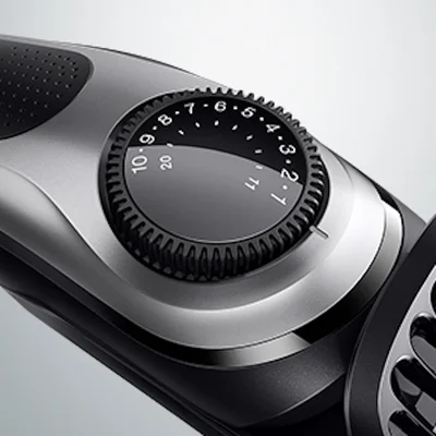 Braun trimmer with precision wheel showing numbered length settings.