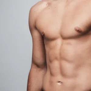 Torso of a man with defined abdominal muscles.