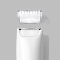 Braun mini hair remover showing the head of the device and a clear plastic cover.