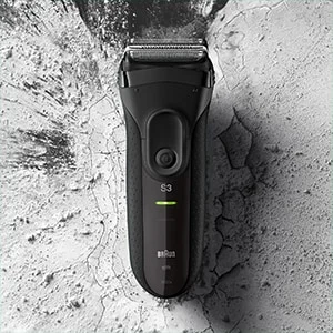 Braun Series 3 electric shaver against a textured background.