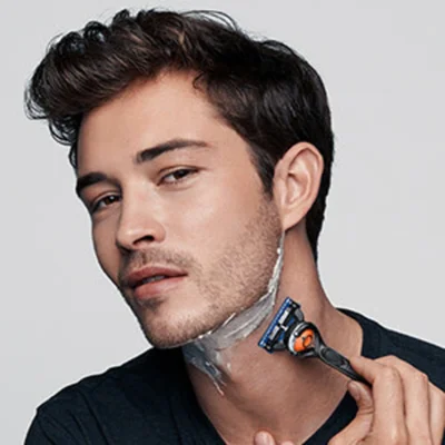 Braun razor being used to shave a man's neck, demonstrating a close and comfortable shave.