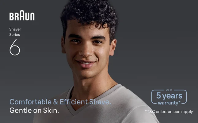 A smiling man with a shaved face. Text says: Comfortable & Efficient Shave.
