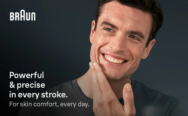 A man smiling, gently touching his shaven face. Texts says Powerful & precise in every stroke