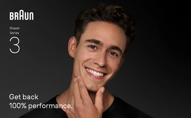 A man smiling, gently touching his shaven face. Texts says 'Get back 100% performance'.