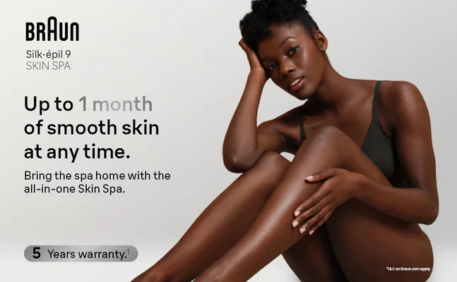 Appreciation shot of a woman sitting on the floor and looking into the camera.