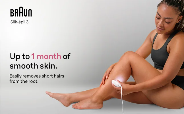 Woman is sitting on the floor and epilating her knee with Silk-epil 9 Flex.