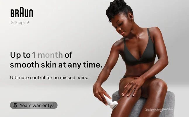 Woman is sitting on a stool and epilating her lower leg with Silk-epil 9.