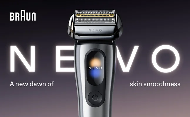 Braun NEVO electric shaver with illuminated logo on dark background.
