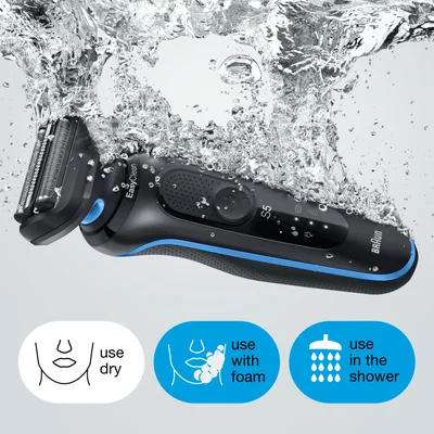 A black and blue Braun EasyClean S5 electric shaver is partially submerged in splashing water, with icons below illustrating use dry, use with foam, and use in the shower.
