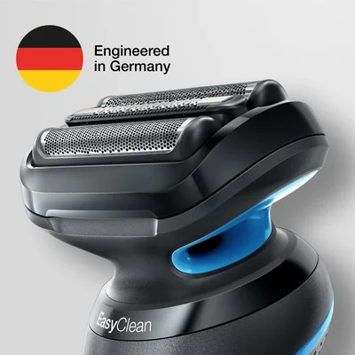 A close-up view of a black and blue electric shaver head with a German flag icon, Engineered in Germany EasyClean.