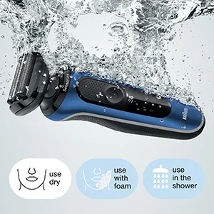 A blue electric shaver is shown partially submerged in splashing water, with three circular icons below it illustrating usage methods, labeled use dry, use with foam, use in the shower.