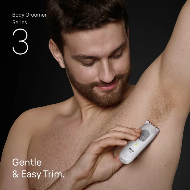 Man using Braun BodyGroomer Series 3 for gentle and easy body hair trimming.