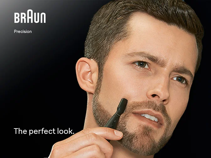 Man using Braun Precision Trimmer to define edges of his moustache.