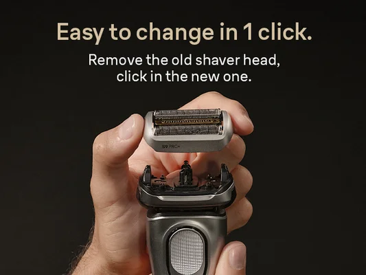 Man's hands holding Braun Shaver and Braun replacement shaver head ready to click in place. Easy to change in click.