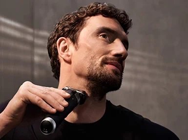 Electric Shavers - Braun - man using Series 9 Pro to shave his foam covered face