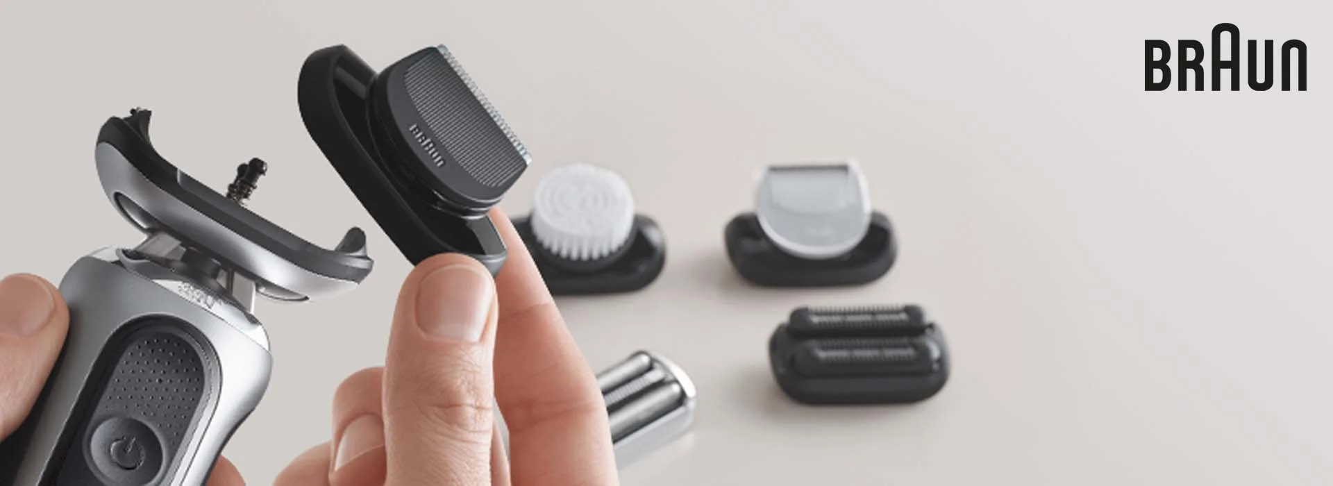 Close up of man holding Series 7 in one hand with beard trimmer attachment in other hand